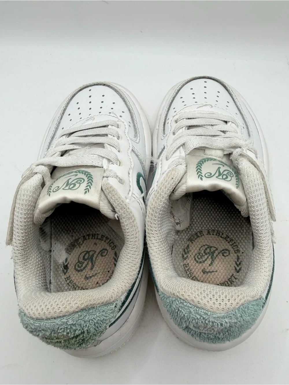 Nike White Kids Sneakers with Dark Green Swoosh